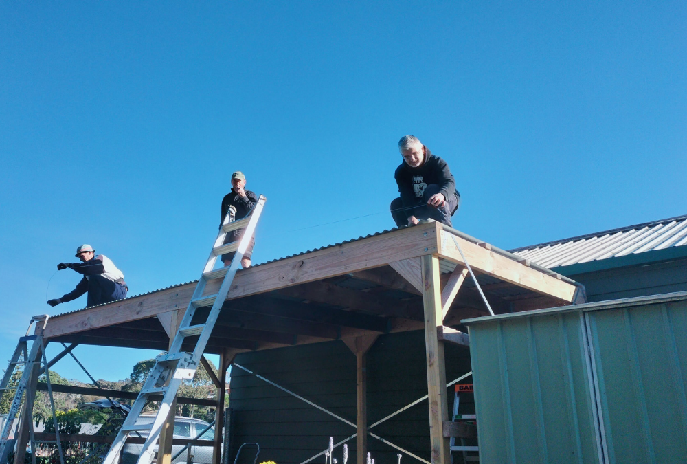 three men on the roof
